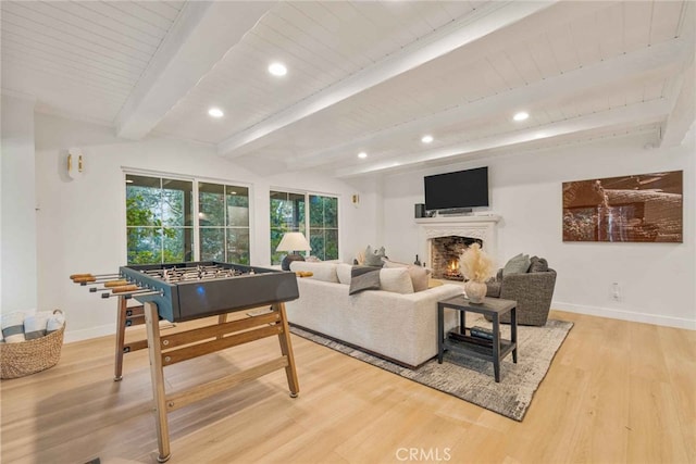 living room featuring beamed ceiling, hardwood / wood-style flooring, and wood ceiling