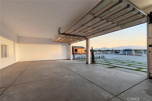 garage at dusk with a water view