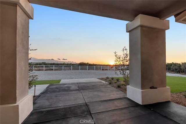 view of patio terrace at dusk