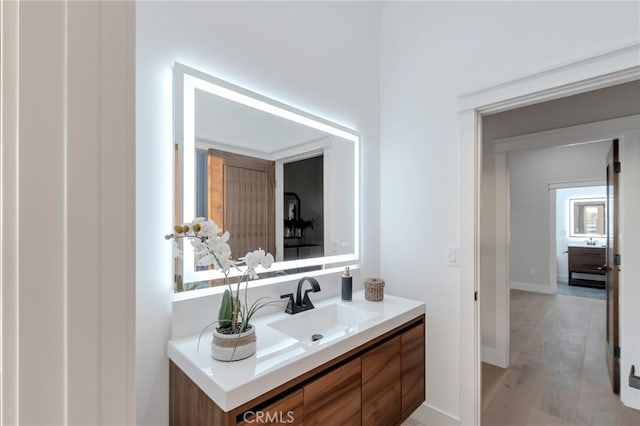 bathroom featuring vanity and hardwood / wood-style flooring