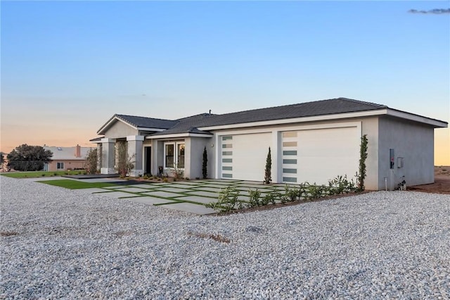 ranch-style home featuring a garage