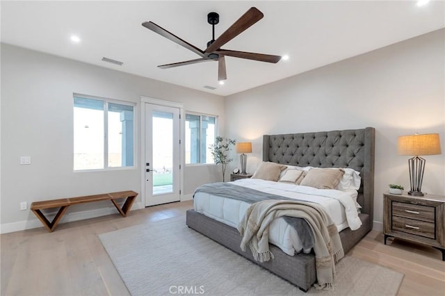 bedroom featuring ceiling fan, access to exterior, and light hardwood / wood-style floors