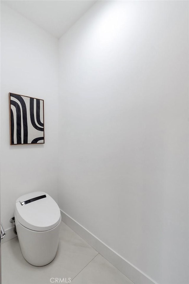 bathroom featuring tile patterned floors and toilet