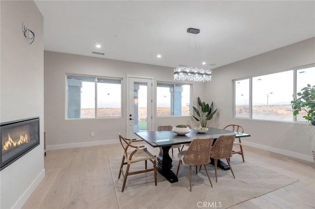 dining space featuring light hardwood / wood-style floors