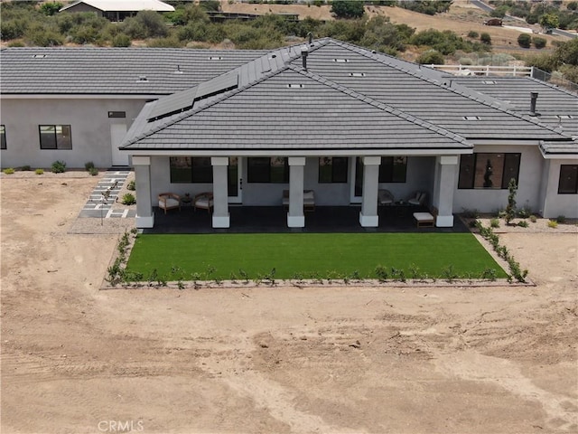 rear view of house with a lawn