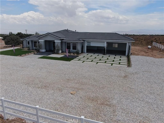 ranch-style house featuring a garage