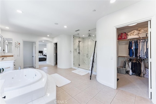 bathroom featuring a marble finish shower, tile patterned floors, a whirlpool tub, vanity, and recessed lighting