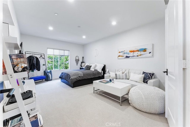 carpeted bedroom with recessed lighting