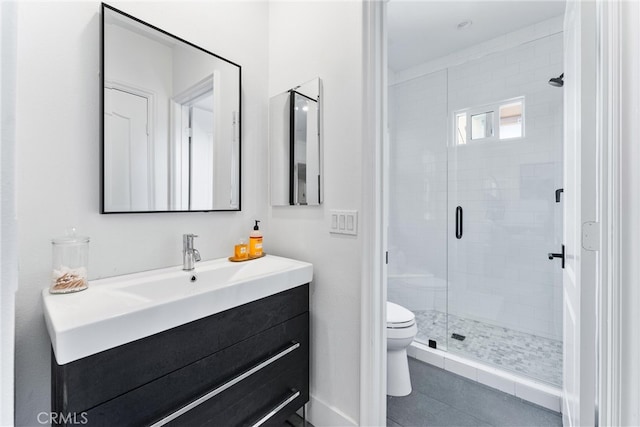 bathroom featuring tile patterned floors, a shower stall, toilet, and vanity