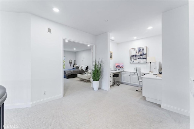 hallway featuring recessed lighting, light colored carpet, visible vents, and baseboards