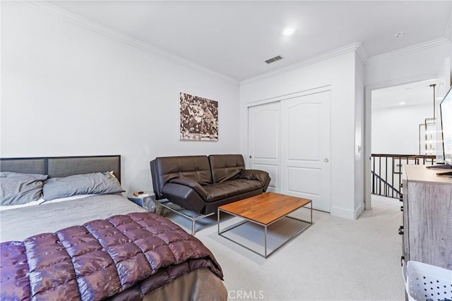 bedroom featuring visible vents, ornamental molding, a closet, and light colored carpet