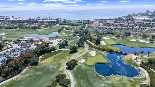 aerial view featuring view of golf course and a water view