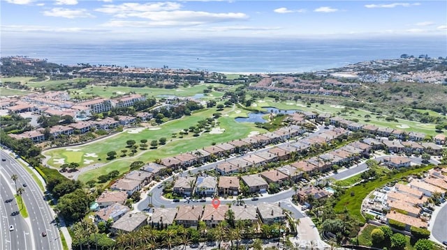 birds eye view of property with a residential view, view of golf course, and a water view