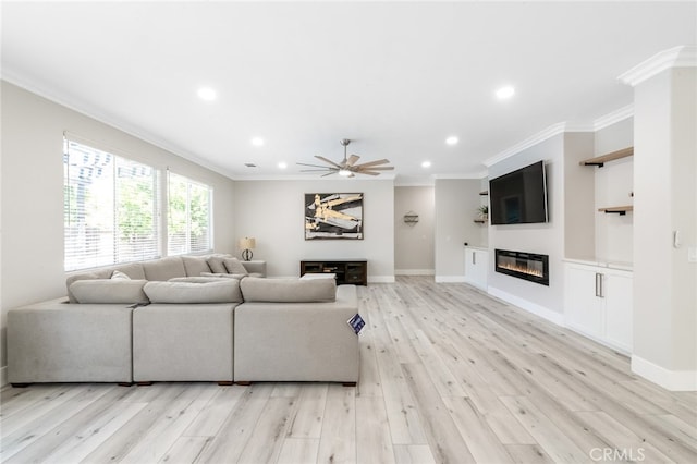 living room featuring light hardwood / wood-style floors, crown molding, and ceiling fan