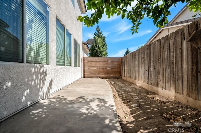 view of side of home featuring a patio