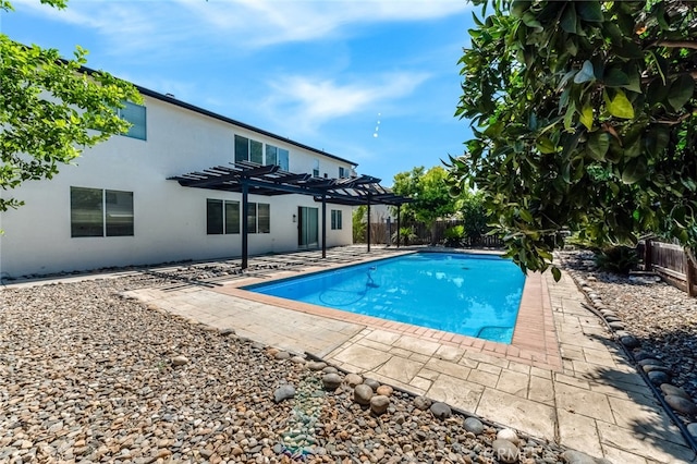 view of pool featuring a patio and a pergola