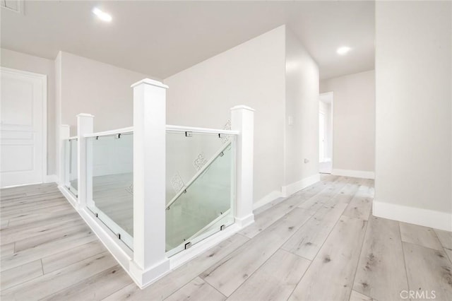4806 W Concord Ave, Visalia, CA 93277 - corridor with an upstairs landing, wood finished floors, baseboards, and recessed lighting