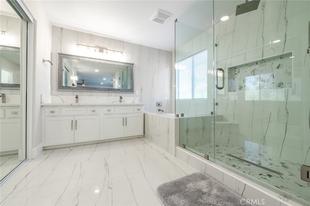 bathroom featuring vanity and shower with separate bathtub