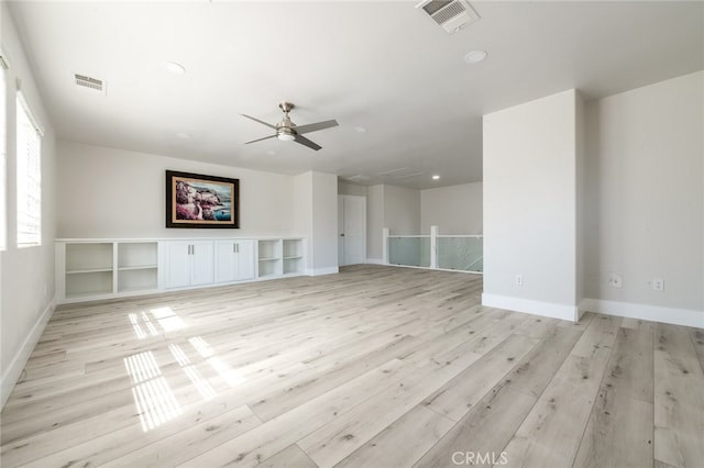 unfurnished living room with light hardwood / wood-style floors and ceiling fan