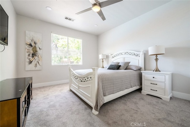 bedroom with ceiling fan and light colored carpet