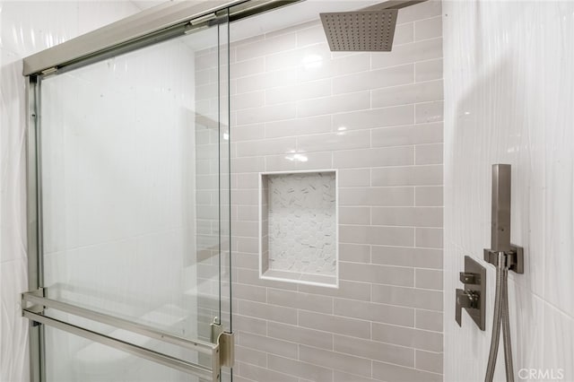 bathroom with a shower with shower door