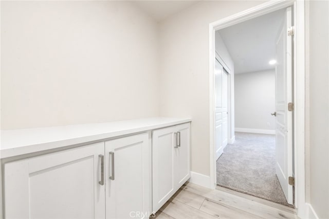 hallway featuring light wood-type flooring