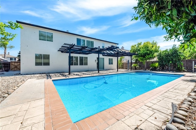 view of pool with a pergola and a patio