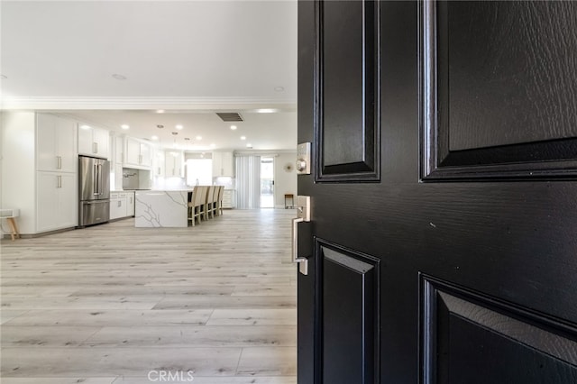 foyer entrance featuring light hardwood / wood-style flooring