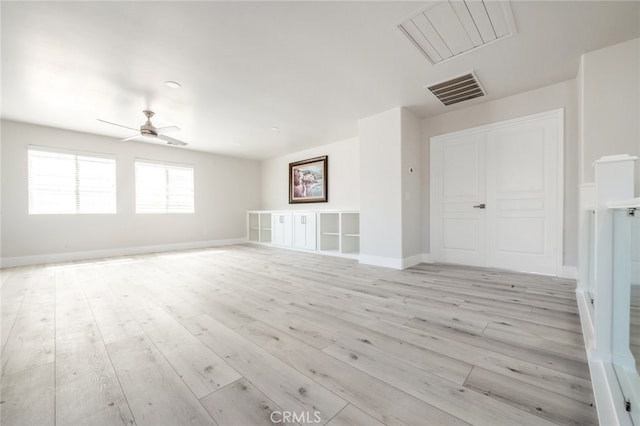 unfurnished room featuring light hardwood / wood-style floors and ceiling fan