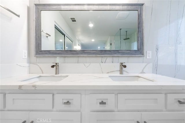 bathroom featuring vanity and walk in shower