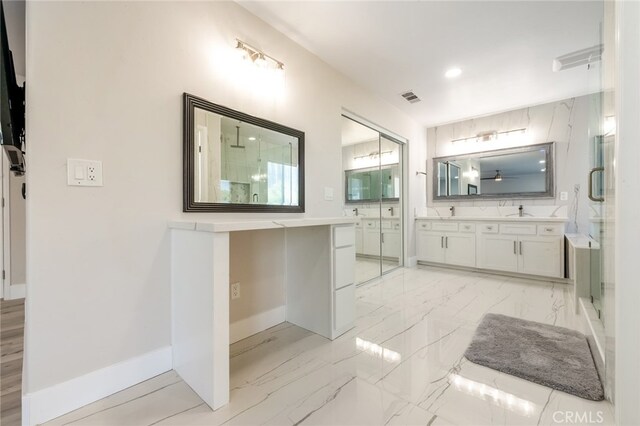 bathroom with vanity and an enclosed shower