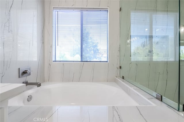 bathroom with independent shower and bath