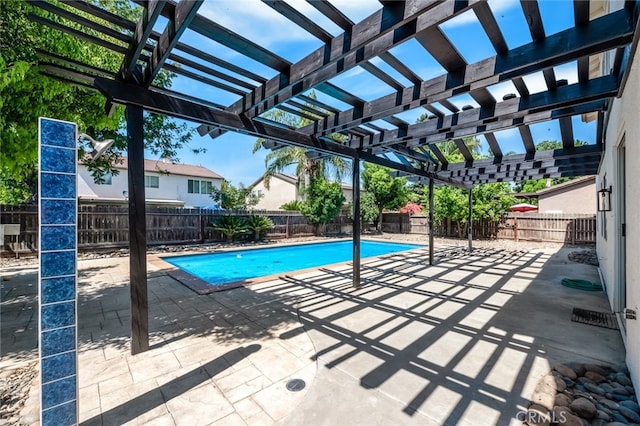 view of swimming pool with a pergola and a patio