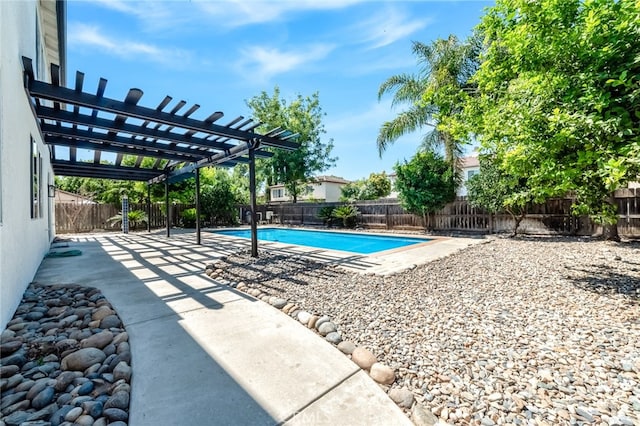 view of swimming pool featuring a patio and a pergola