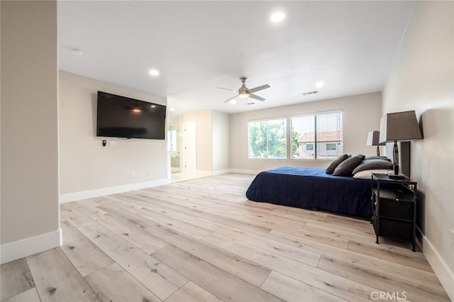 bedroom with ceiling fan and light hardwood / wood-style flooring