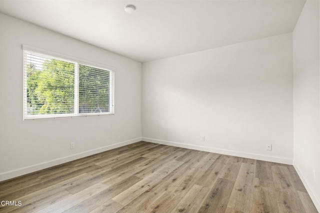 unfurnished room featuring light wood-type flooring