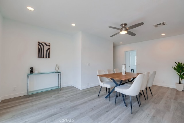 dining area featuring light hardwood / wood-style floors and ceiling fan