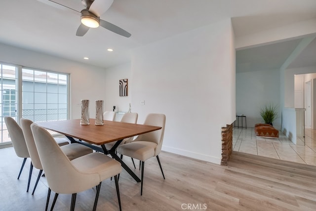 dining room featuring ceiling fan and light wood-type flooring