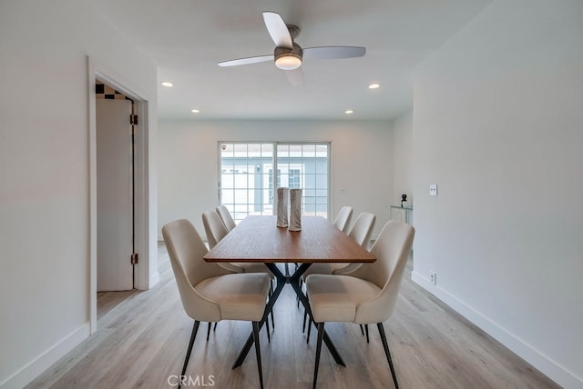 dining area featuring ceiling fan and light wood-type flooring