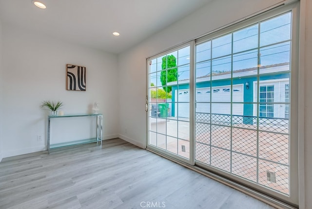 doorway to outside with hardwood / wood-style flooring