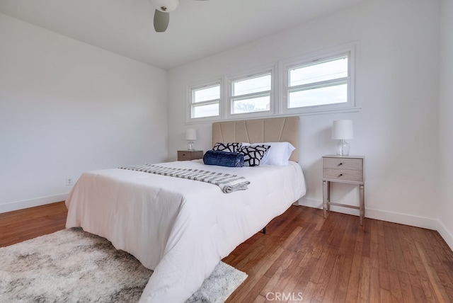 bedroom with hardwood / wood-style flooring and ceiling fan