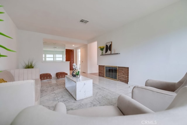 tiled living room with a brick fireplace