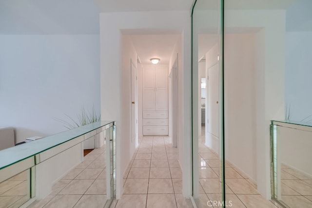 hallway featuring light tile patterned floors