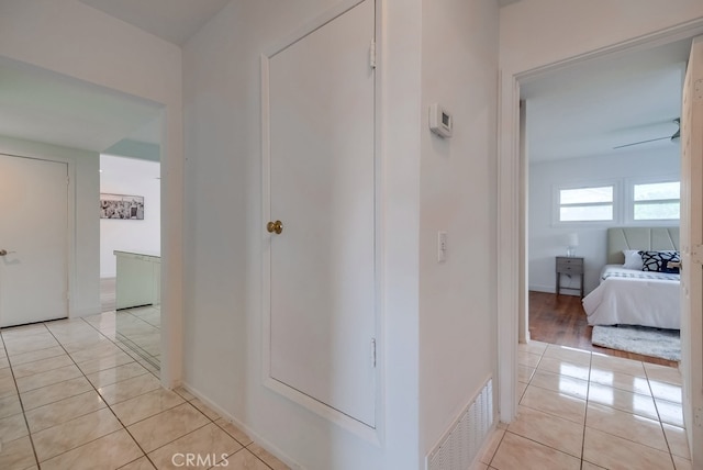 hallway with light tile patterned floors