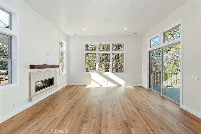 unfurnished living room with light hardwood / wood-style floors