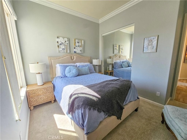bedroom featuring a closet, carpet, baseboards, and ornamental molding