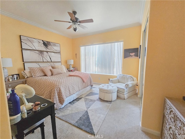 bedroom with ceiling fan, light colored carpet, crown molding, and a closet