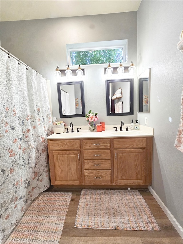 bathroom featuring hardwood / wood-style floors and vanity