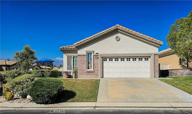 mediterranean / spanish-style home with a garage