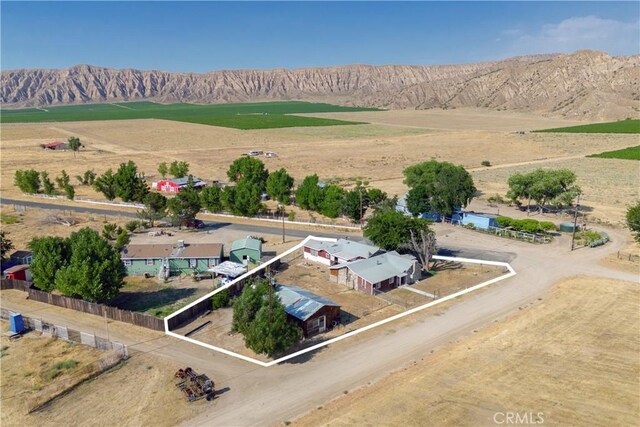 birds eye view of property with a mountain view and a rural view